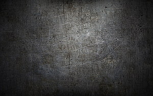 Dark scratched metal surface with industrial grunge texture and dramatic lighting HD wallpaper