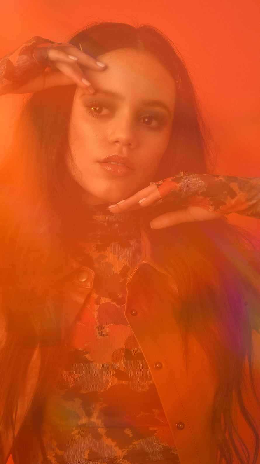 Jenna Ortega Portrait in Warm Orange Light with Dramatic Studio Lighting HD phone wallpaper