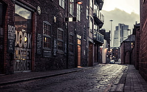 Moody Cobblestone Alleyway in Liverpool's Dock Street Market District HD wallpaper