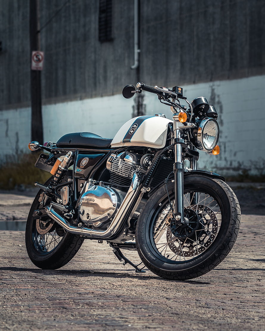 Classic Royal Enfield Bullet Motorcycle with White and Black Tank HD phone wallpaper