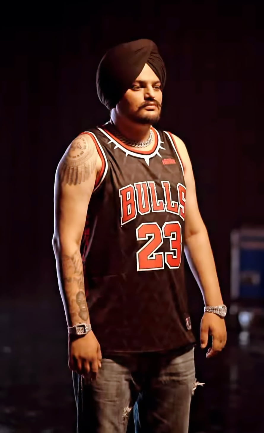 Sidhu Moose Wala wearing a black Chicago Bulls jersey and turban HD phone wallpaper