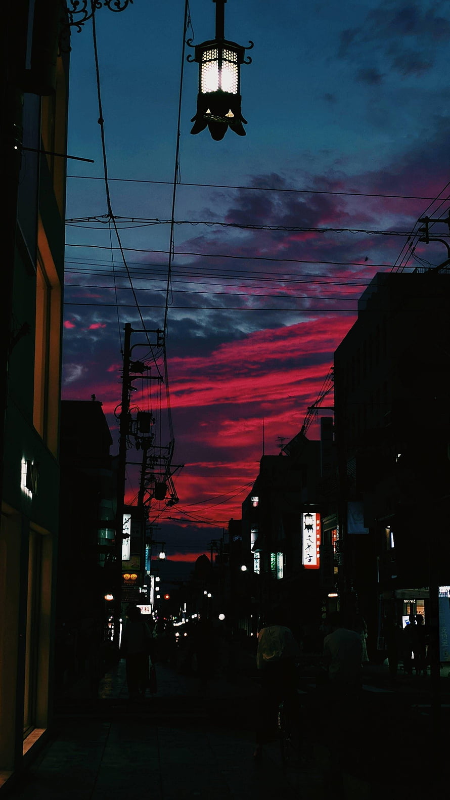 Vibrant Crimson Sunset Over a Silhouetted Japanese Street at Dusk HD phone wallpaper