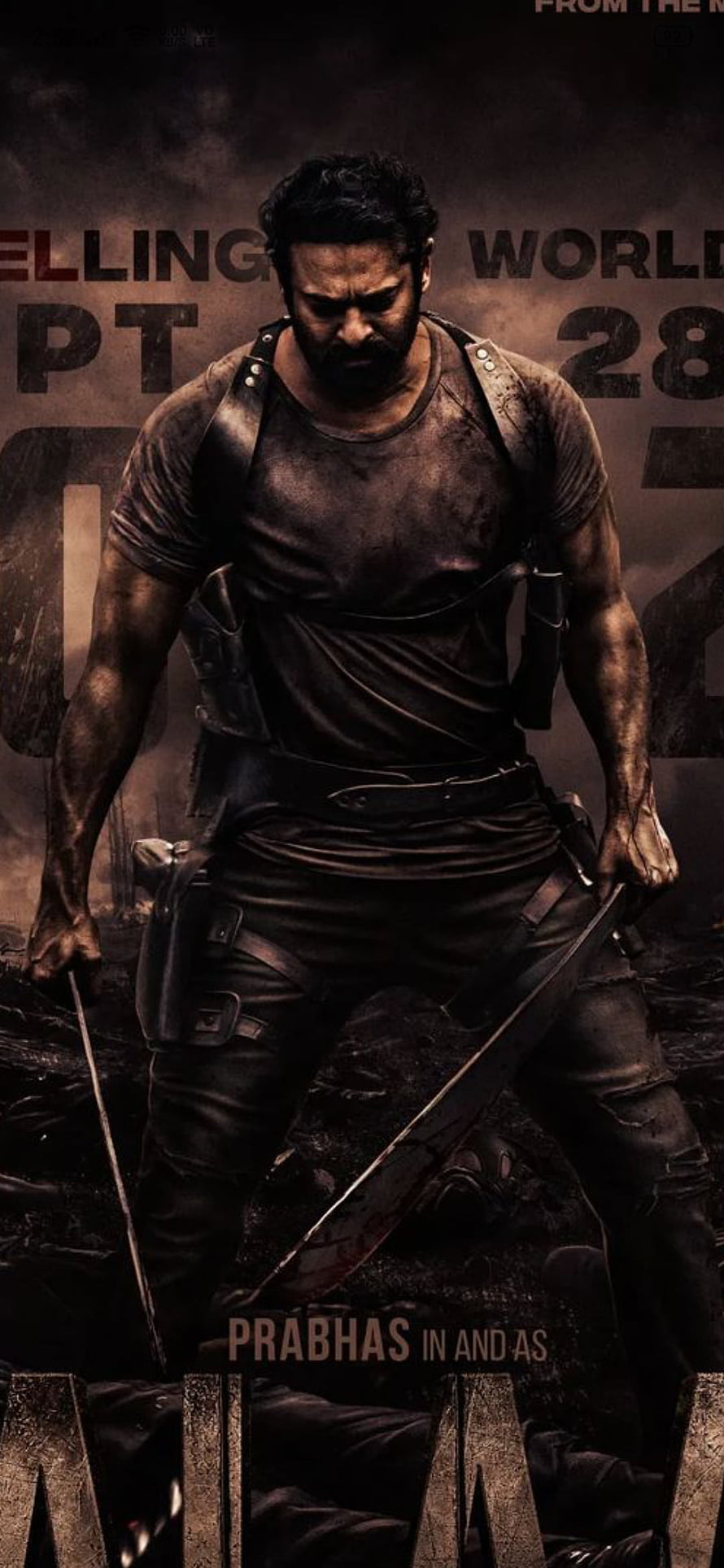 Prabhas in Salaar action film poster with sword and tactical gear HD phone wallpaper