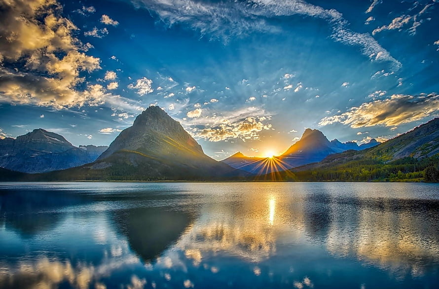 Stunning Mountain Lake Sunrise with Golden Sun Rays and Cloud Reflections HD wallpaper