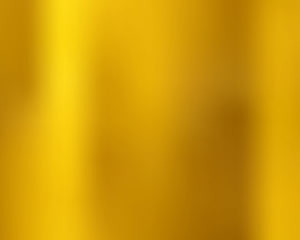 Abstract Golden Yellow Gradient Background With Soft Blurred Light Effects HD wallpaper