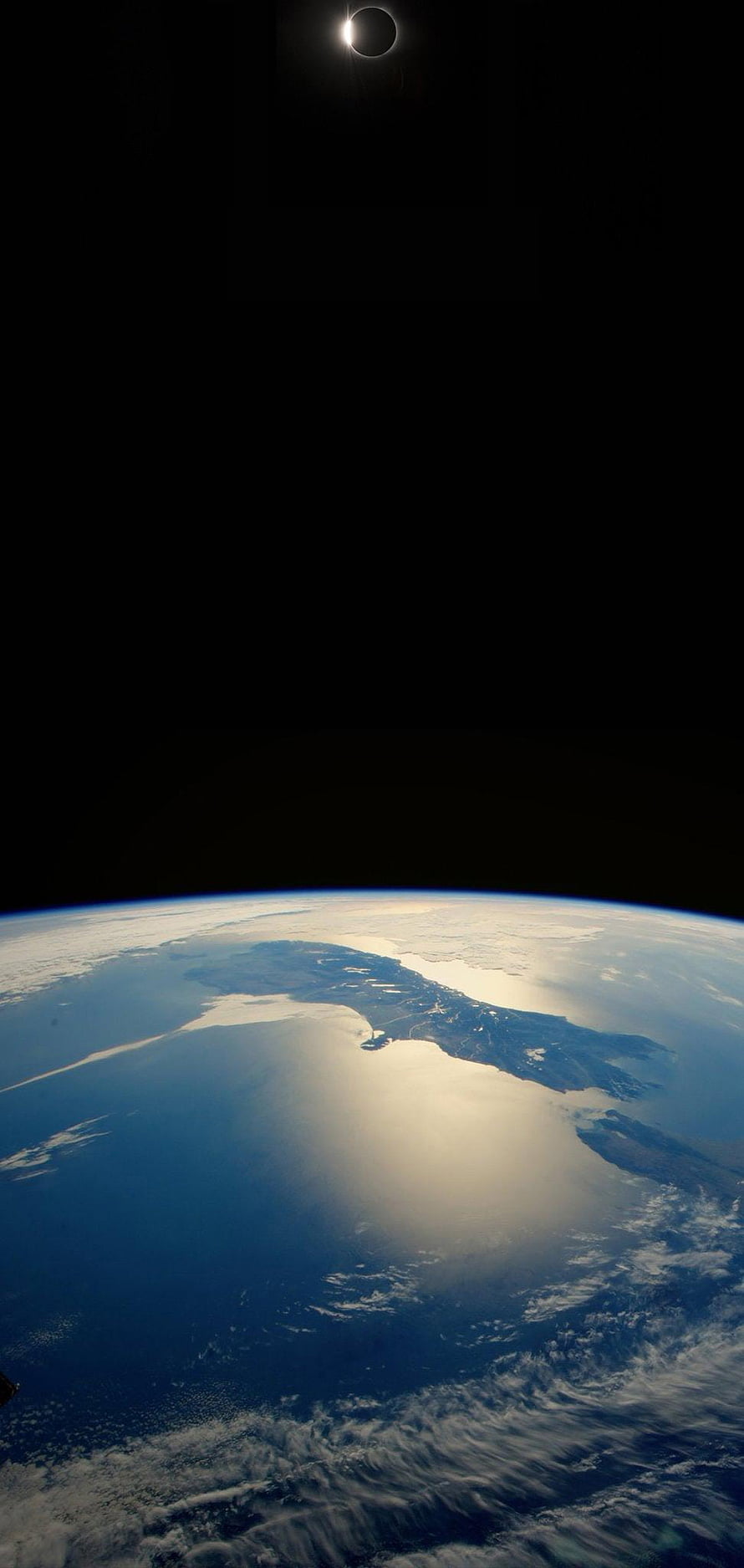 Solar Eclipse Over Earth From Space View With Ocean And Clouds HD phone wallpaper