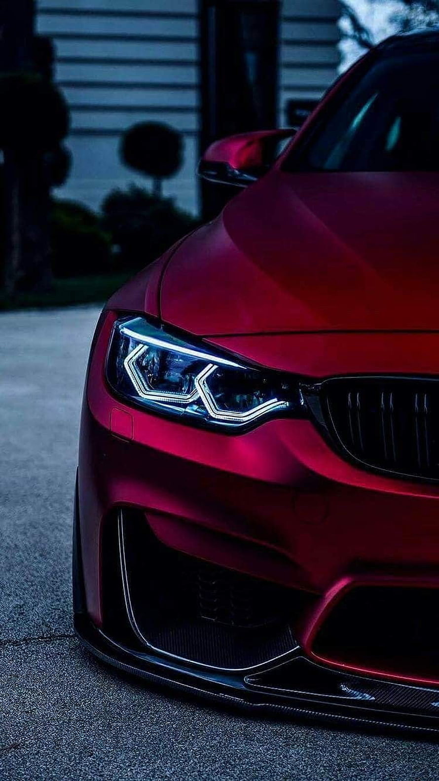 Close-Up of Matte Red BMW M3 Front Bumper and LED Headlights HD phone wallpaper