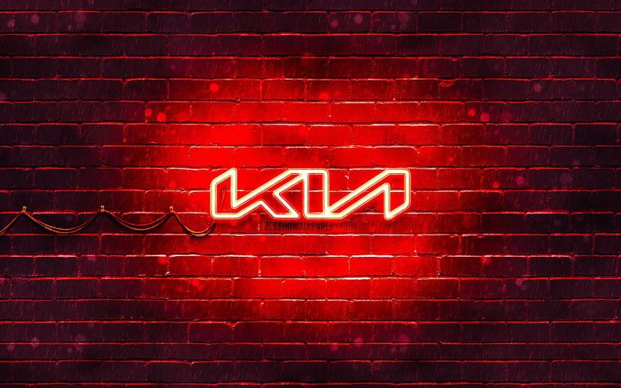 Kia Neon Logo Glowing on Dark Red Brick Wall with Dramatic Lighting HD wallpaper