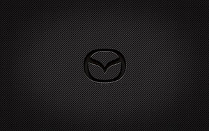 Mazda emblem on dark carbon fiber texture with subtle diagonal weave pattern HD wallpaper