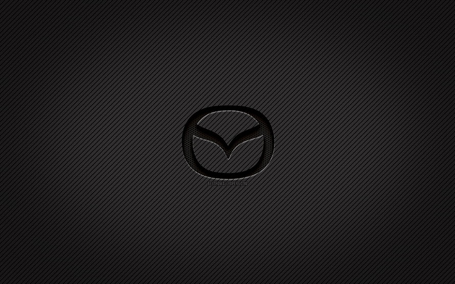 Mazda emblem on dark carbon fiber texture with subtle diagonal weave pattern HD wallpaper