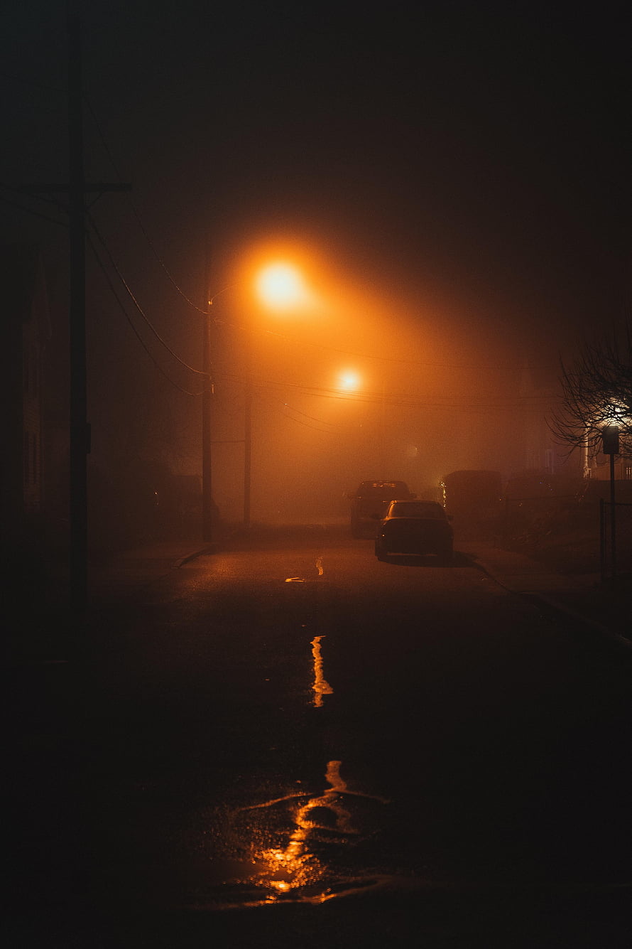 Atmospheric Night Street Scene With Orange Streetlights And Foggy Reflections HD phone wallpaper