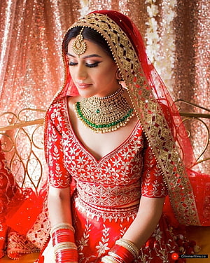 Elegant Indian Bride in Red Lehenga with Gold Jewelry and Dupatta HD phone wallpaper