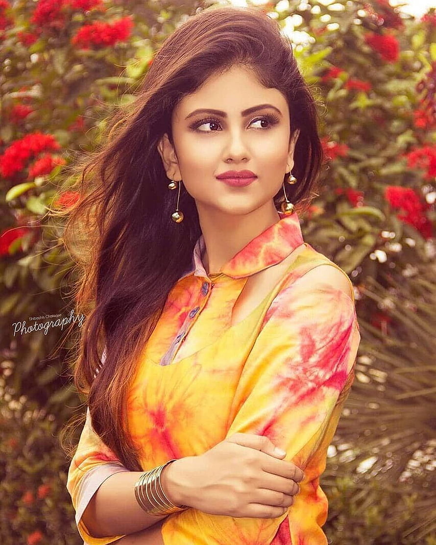 Portrait of a woman in a vibrant yellow and red tie-dye kurta with long wavy hair, Girls dp, Beautiful Indian HD phone wallpaper