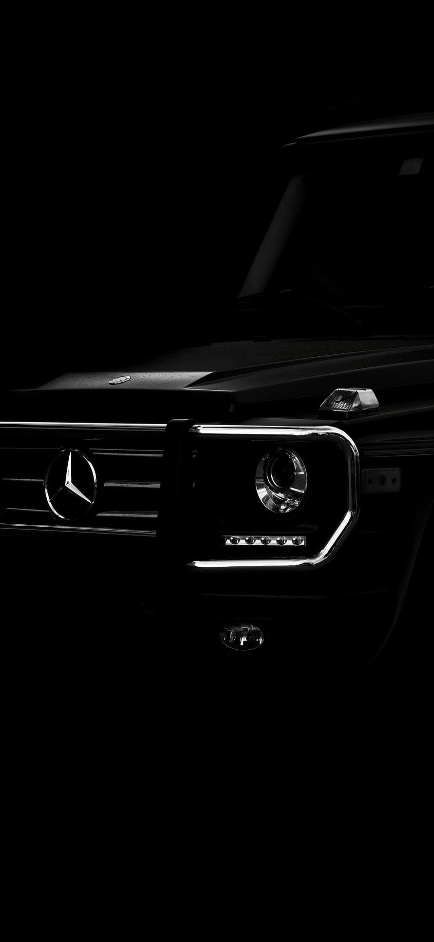 Mercedes-Benz G-Class Front Grille and Headlight Detail in Dark Lighting HD phone wallpaper