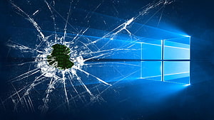 Windows 10 Logo on a Shattered Glass Screen with Digital Glitch Effect HD wallpaper