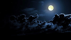 Gibbous Moon Rising Above Dark Storm Clouds in a Deep Blue Night Sky HD wallpaper