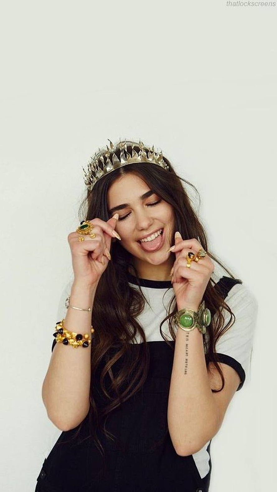 Dua Lipa Wearing a Gold Crown and Statement Jewelry in a Playful Studio Portrait HD phone wallpaper