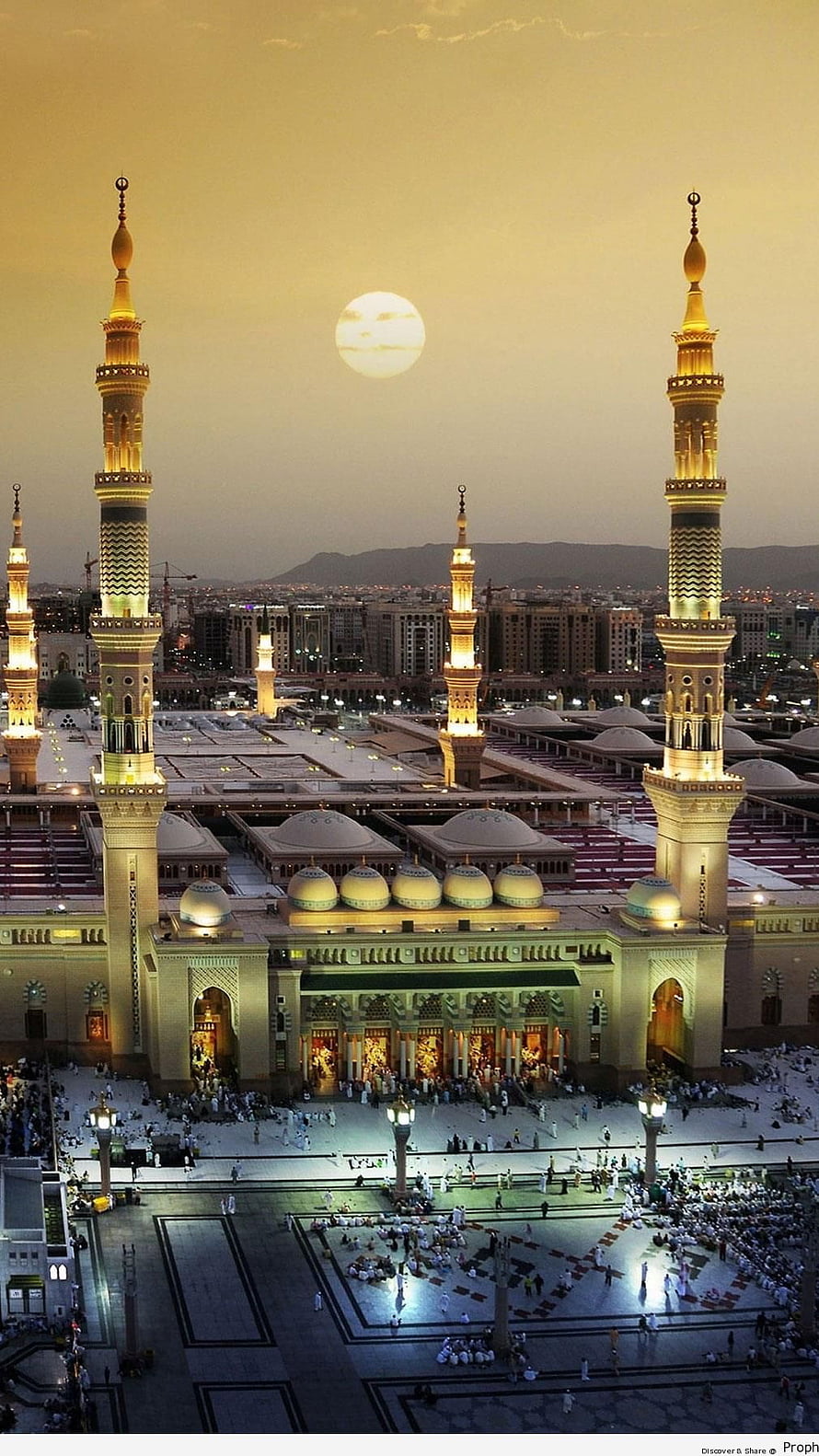 Al-Masjid an-Nabawi in Medina at dusk with full moon and illuminated minarets HD phone wallpaper