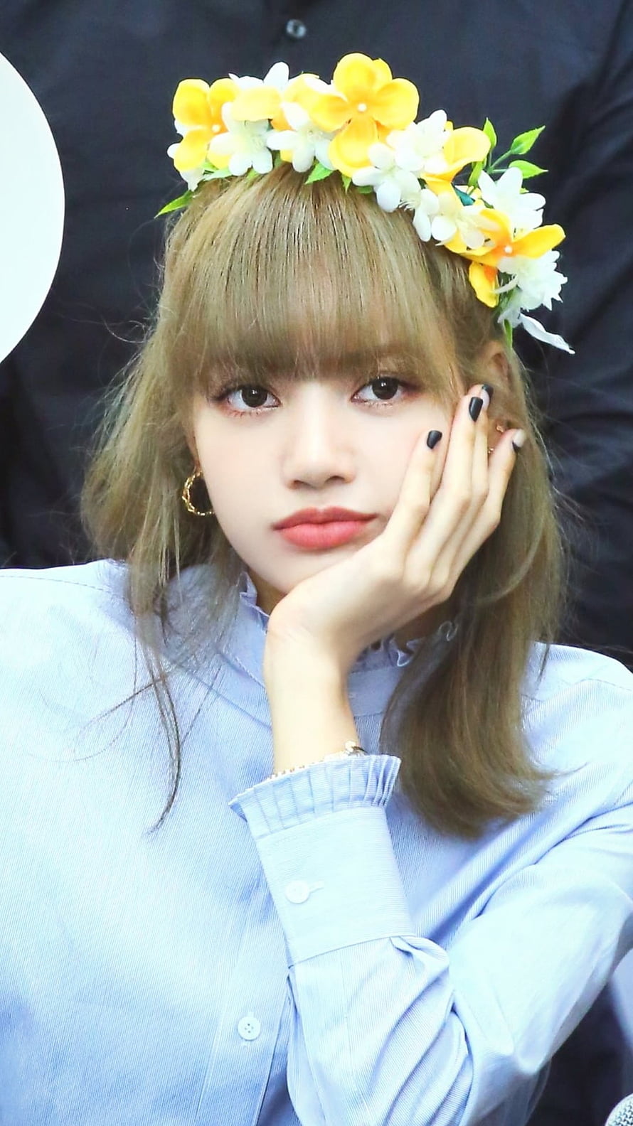Lisa from Blackpink wearing a yellow and white flower crown with a blue shirt HD phone wallpaper