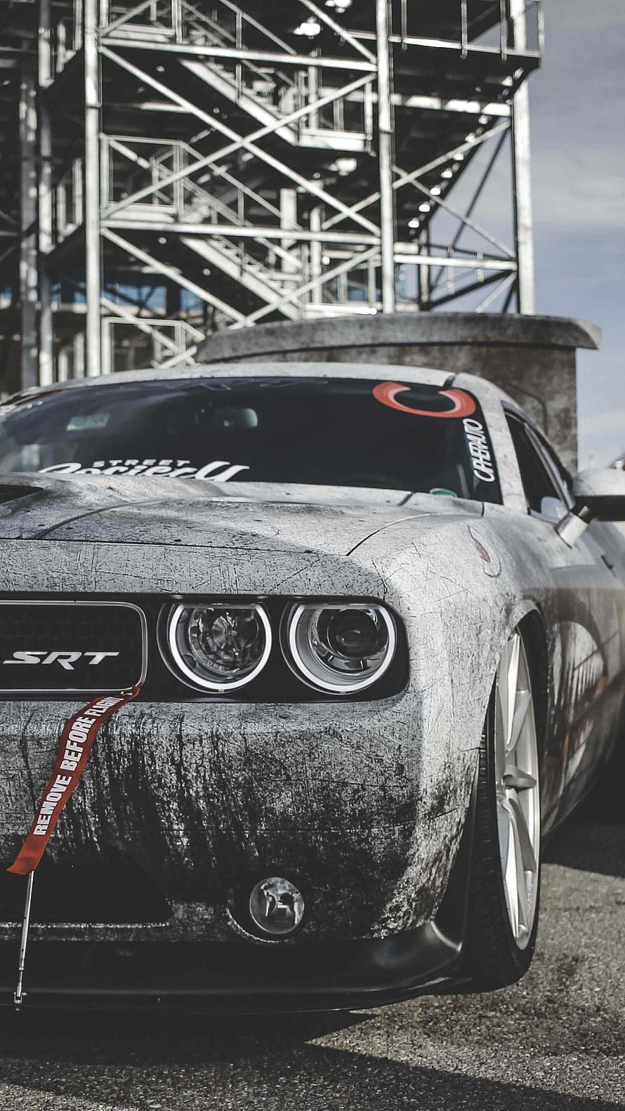 Dodge Challenger SRT8 Matte Black Front View with Industrial Background HD phone wallpaper