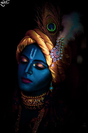 Portrait of Lord Krishna with Blue Skin, Peacock Feather Crown, and Traditional Indian Jewelry HD phone wallpaper