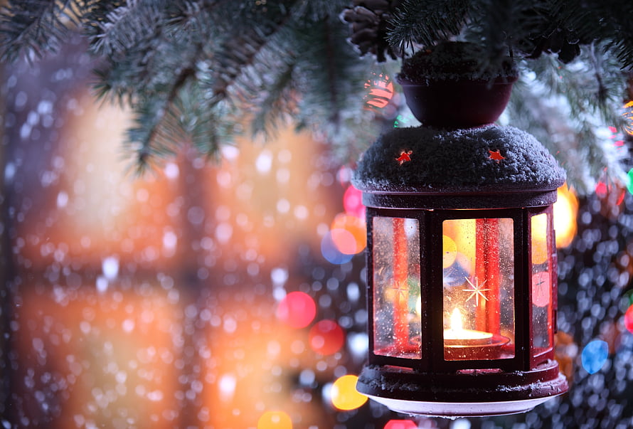 Snowy Christmas Lantern with Candlelight Hanging from Pine Branch HD wallpaper