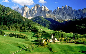 Stunning Dolomites Landscape with Green Hills and Mountain Peaks HD wallpaper
