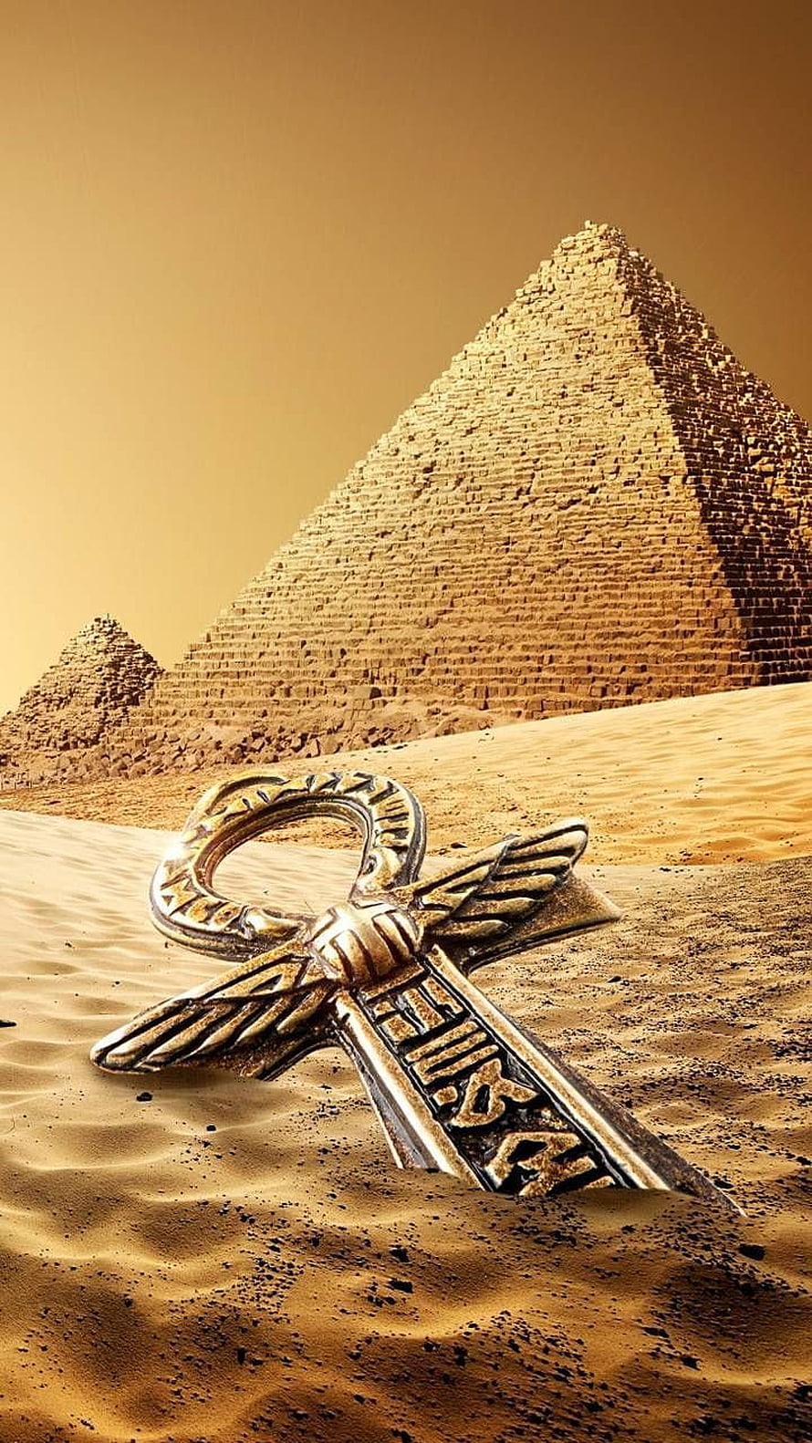 Golden Ankh Key Resting in Sand Before the Great Pyramids of Giza HD phone wallpaper