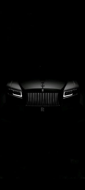 Dark Rolls-Royce Front View With Illuminated Headlights And Chrome Grille HD phone wallpaper