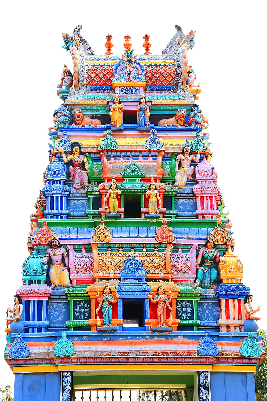 Vibrant Multi-Tiered Gopuram of a Tamil Hindu Temple with Colorful Deity Sculptures HD phone wallpaper