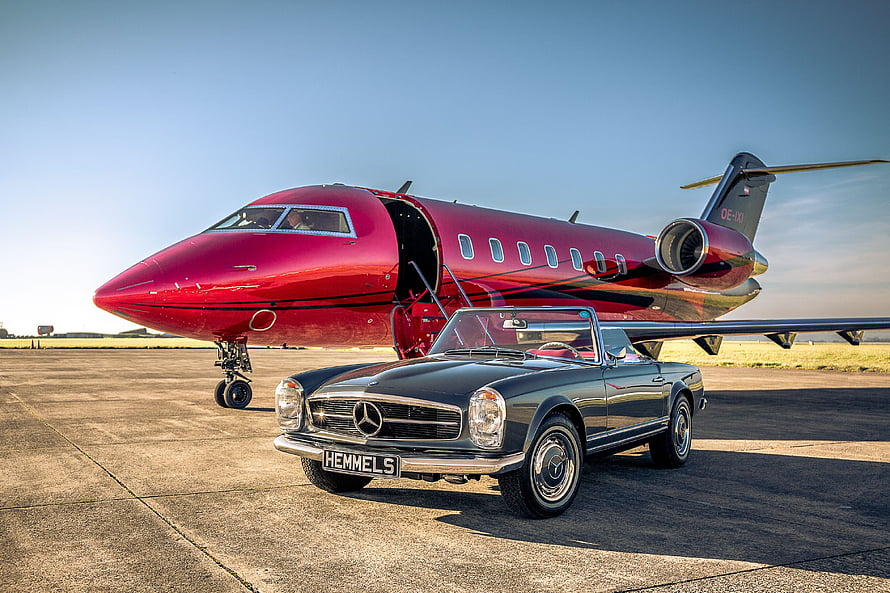 Classic Mercedes-Benz 280 SL Parked Before a Red Private Jet on the Tarmac HD wallpaper