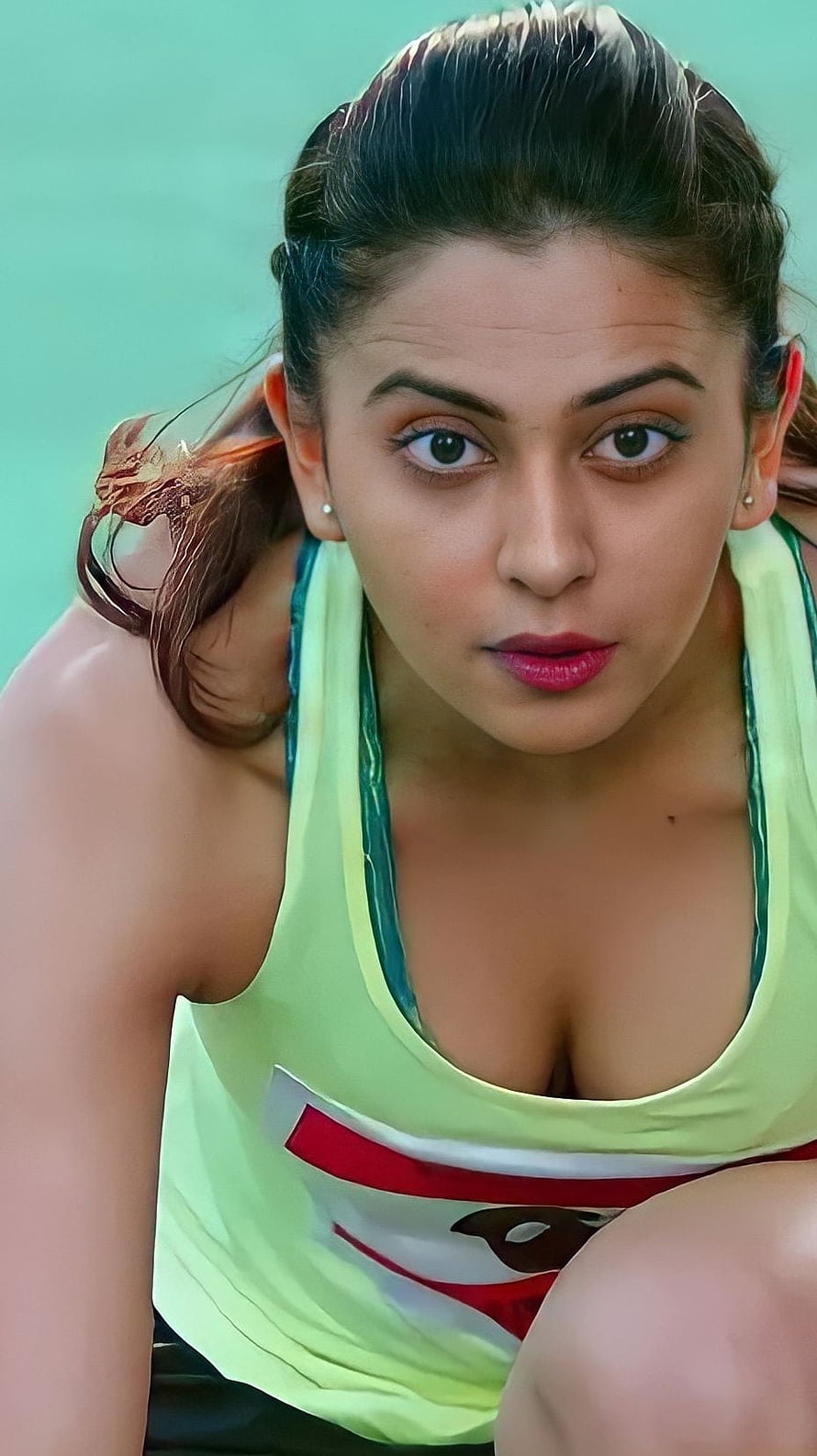 Deepika Padukone in Neon Yellow Sports Top Portrait HD phone wallpaper