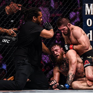 Khabib Nurmagomedov and Conor McGregor in UFC Octagon Ground Fight HD phone wallpaper