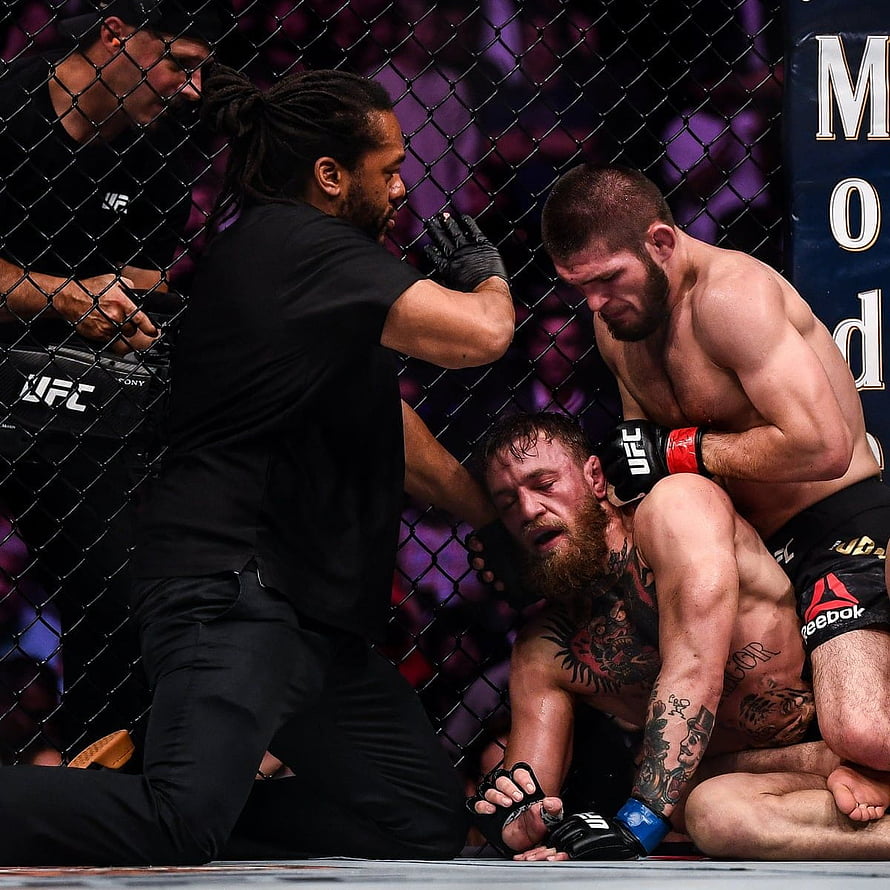 Khabib Nurmagomedov and Conor McGregor in UFC Octagon Ground Fight HD phone wallpaper