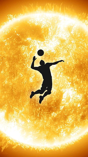 Volleyball Player Silhouette Against a Glowing Solar Flare Background HD phone wallpaper