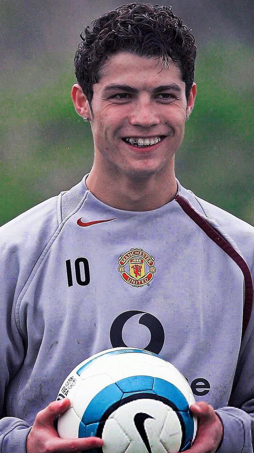 Young Cristiano Ronaldo in Manchester United Training Kit Holding a Soccer Ball HD phone wallpaper