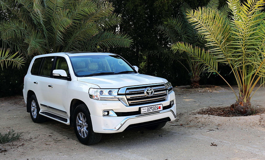 White Toyota Land Cruiser SUV Parked Among Palm Trees HD wallpaper