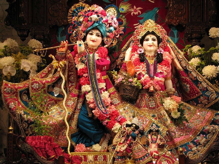 Radha Krishna Temple Idol Adorned With Fresh Flowers And Ornate Jewelry HD wallpaper