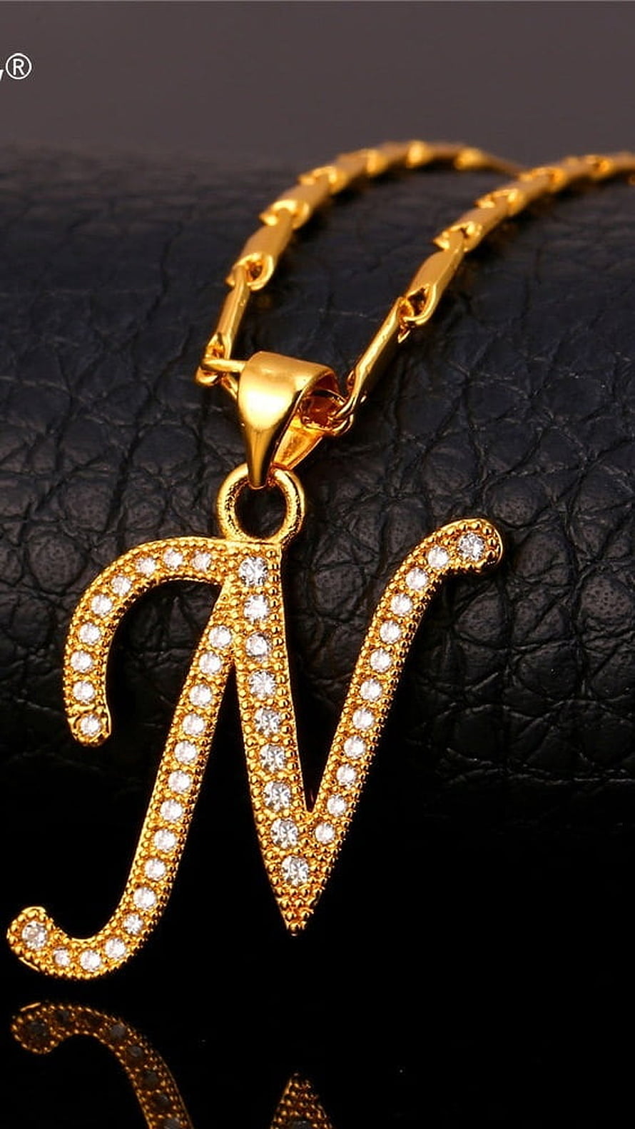 Gold Letter N Pendant Necklace with Crystal Inlay on Black Leather Background HD phone wallpaper