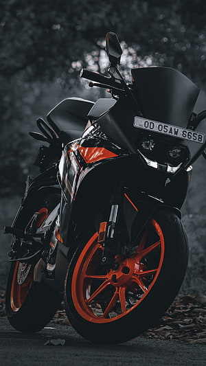 KTM RC 200 Black and Orange Motorcycle in Forest Setting HD phone wallpaper
