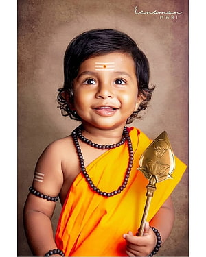 Cute Baby Boy Dressed as Hindu Priest with Tilak and Golden Lotus Staff HD phone wallpaper