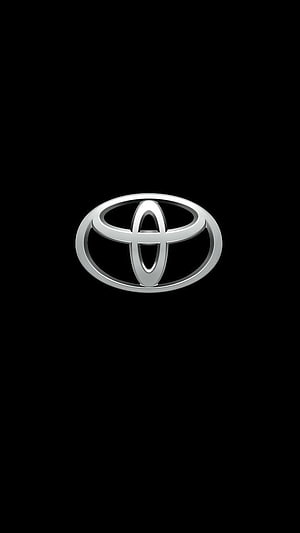 Sleek Silver Toyota Emblem Centered on a Minimalist Black Background HD phone wallpaper