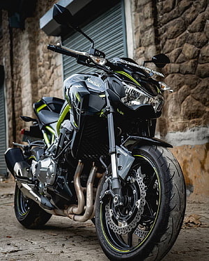 Kawasaki Z900 Black and Lime Green Motorcycle Parked on Street HD phone wallpaper