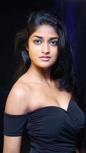 Portrait of a woman with long black hair wearing an elegant off-shoulder black top against a dark background, Dimple Hayathi, Heroine Dimple HD phone wallpaper