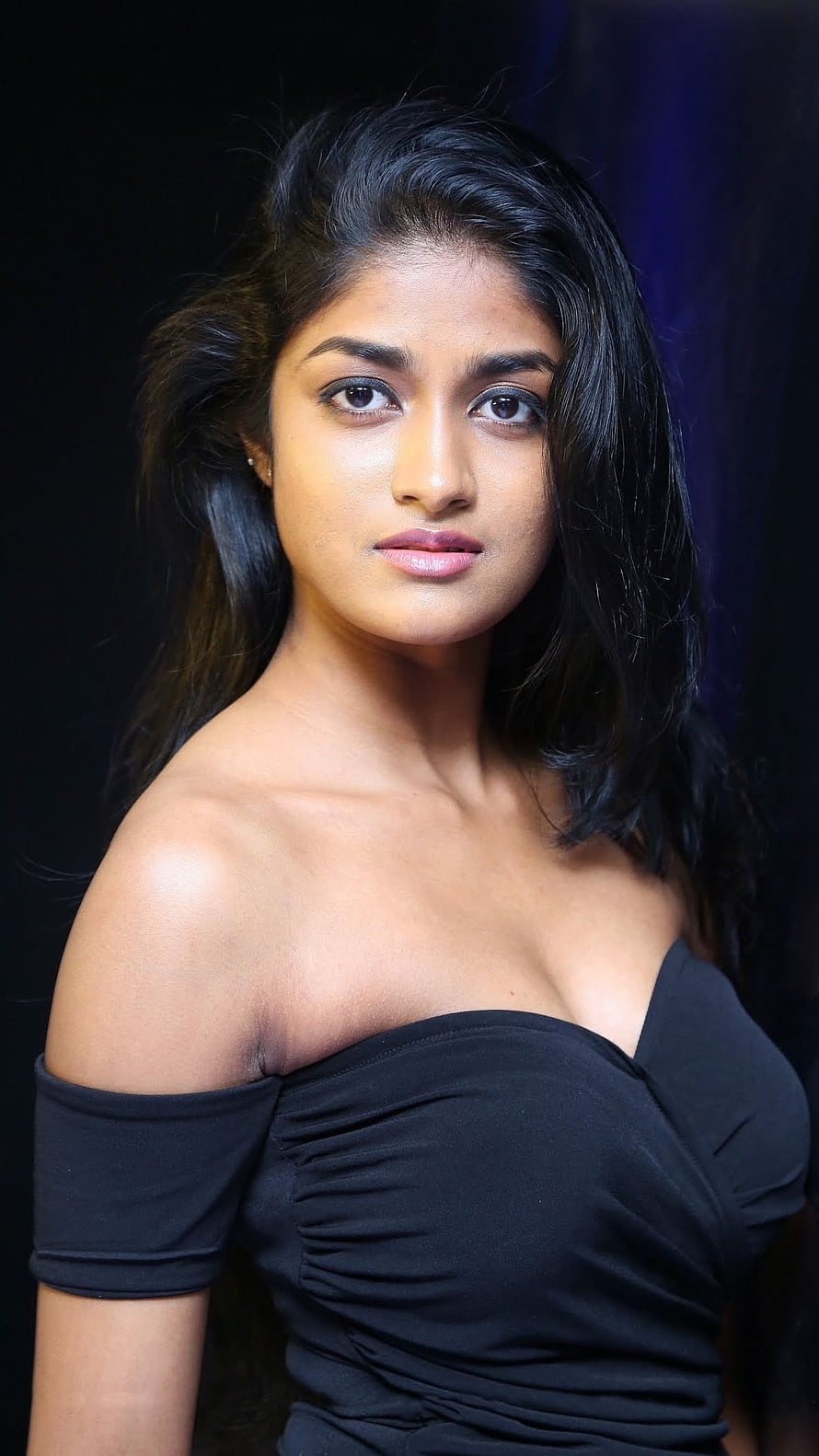 Portrait of a woman with long black hair wearing an elegant off-shoulder black top against a dark background, Dimple Hayathi, Heroine Dimple HD phone wallpaper