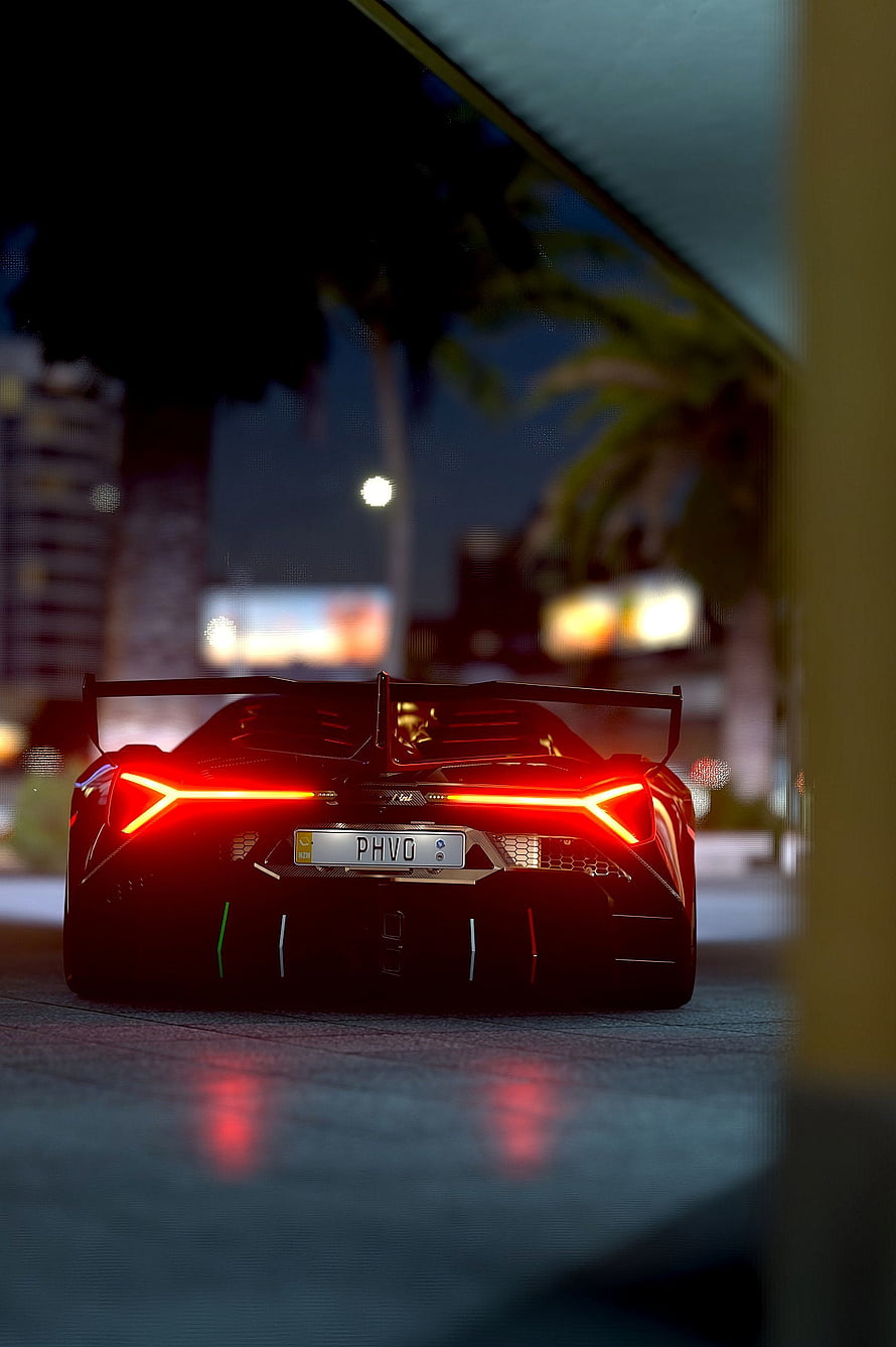Lamborghini Sian rear view with glowing red taillights and large spoiler at night HD phone wallpaper