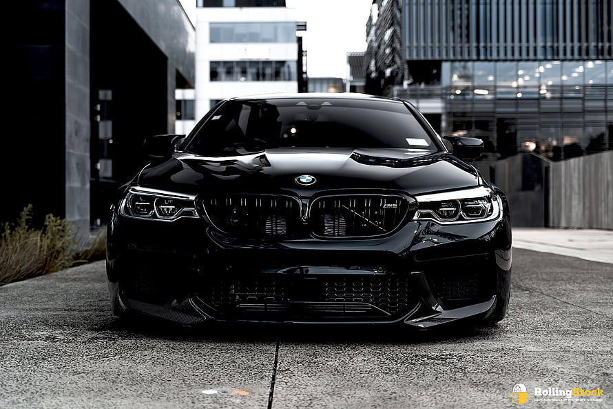 Black BMW M5 Competition F90 Front View in Urban Setting HD wallpaper