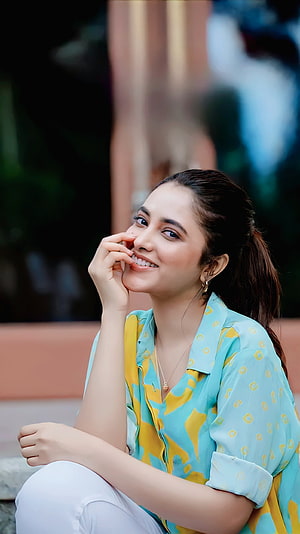 Priyanka Mohan smiling portrait in a turquoise and yellow patterned shirt HD phone wallpaper