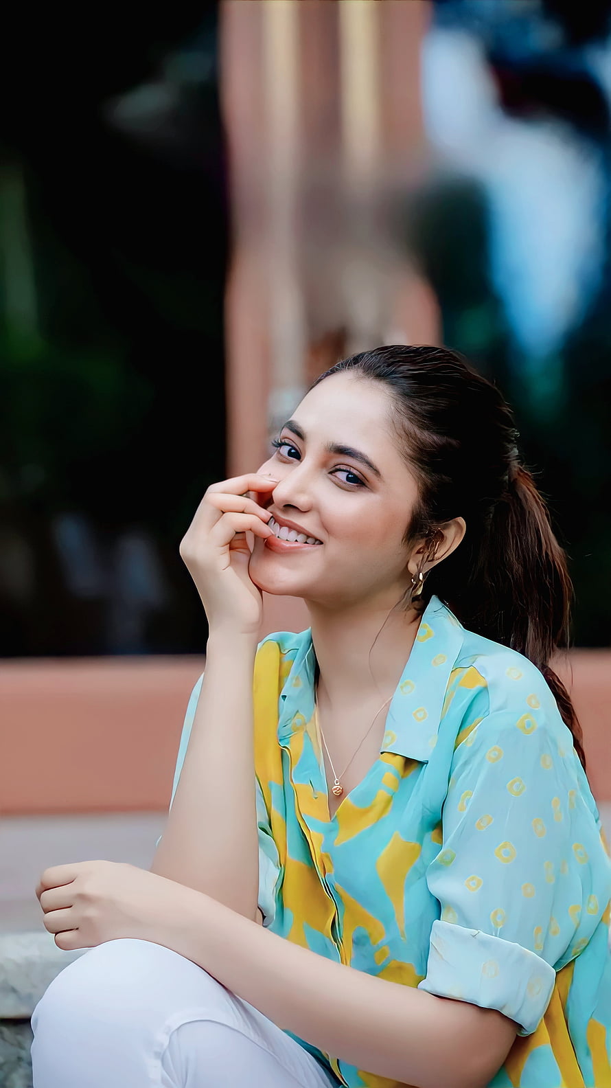 Priyanka Mohan smiling portrait in a turquoise and yellow patterned shirt HD phone wallpaper