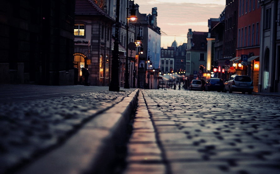 Low Angle View of Cobblestone Street in European City at Dusk HD wallpaper